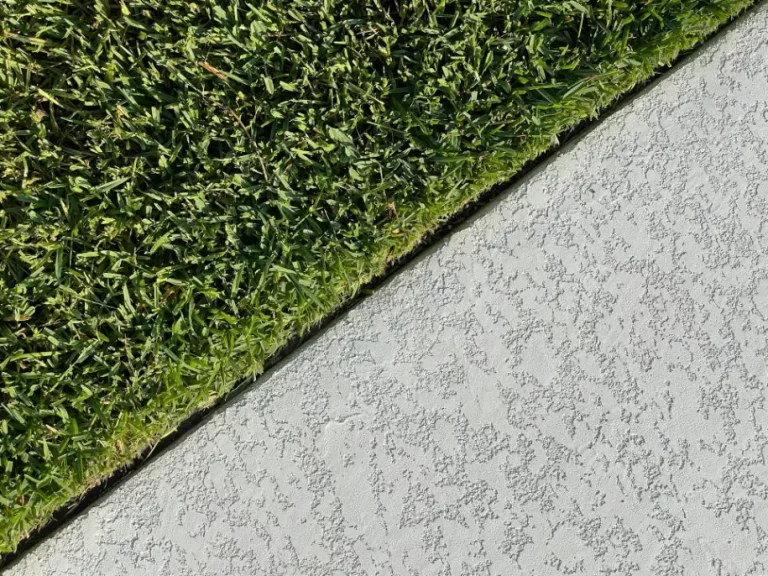 image of grass and concrete symbolising ISO 14001 vs Net Zero ISO What's the Difference