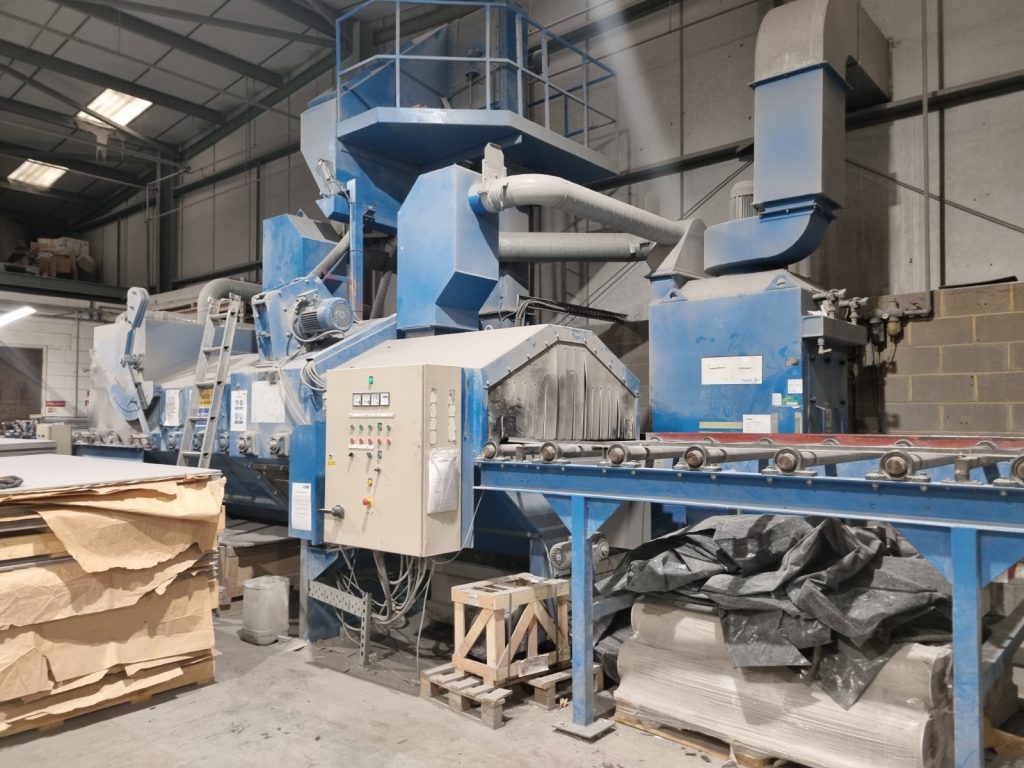 Image of machinery and conveyer belt.